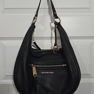 Michael Kors Rhea Large Shoulder Bag in black pebbled leather.